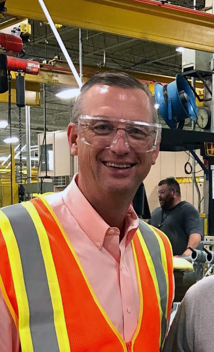 Rep. Morgan Griffith (VA-09) wearing a safety vest and safety glasses as he visits a production facility.